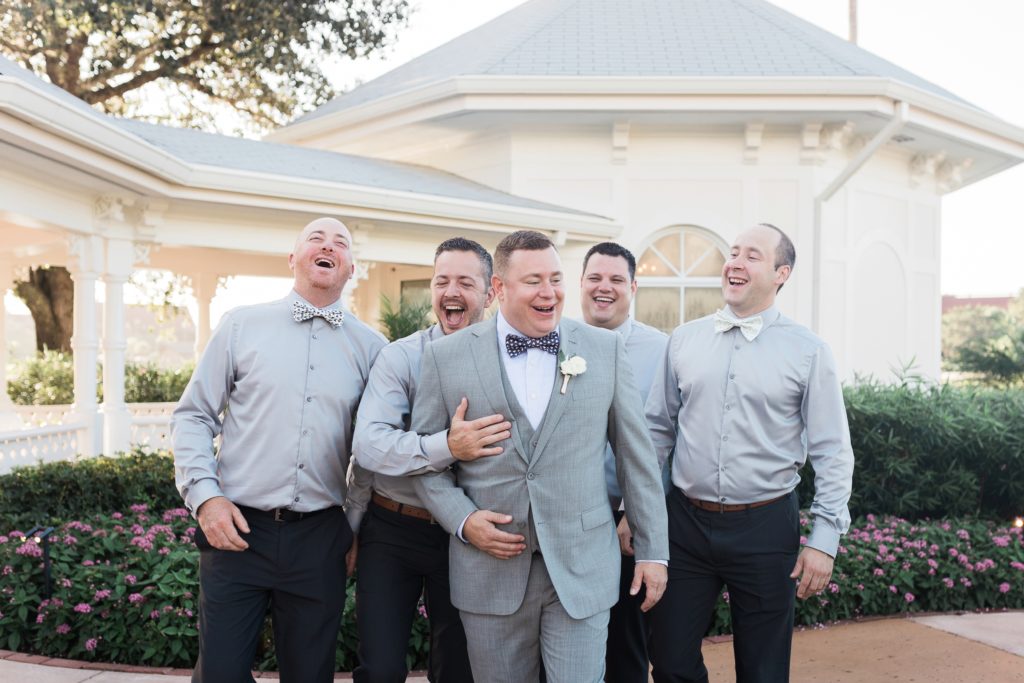groom and groomsman having fun at Disney wedding