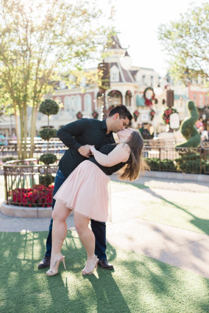 Couple in Magic Kingdom Engagement Shoot dancing with each other.