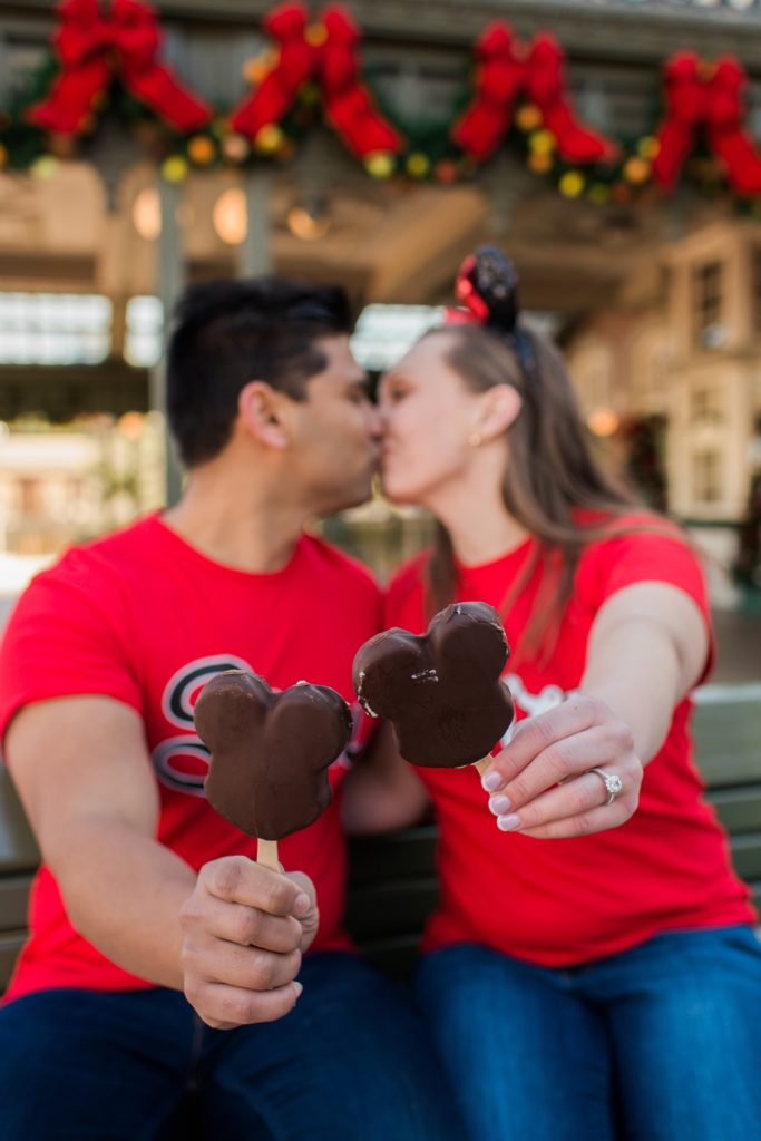 Couple with Mikey Mouse treats in Magic Kingdom