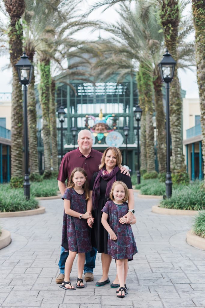 Family photos under palm trees at Disney's Port Orleans Resort
