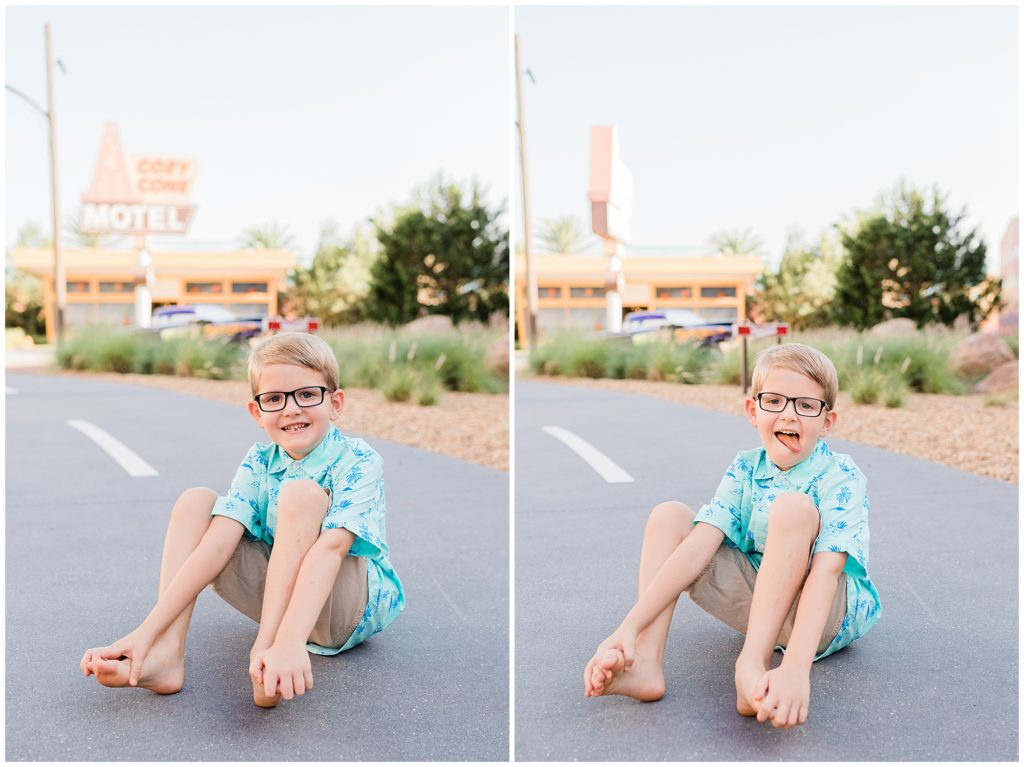 happy boy making silling faces while sitting on road in Radiator Springs
