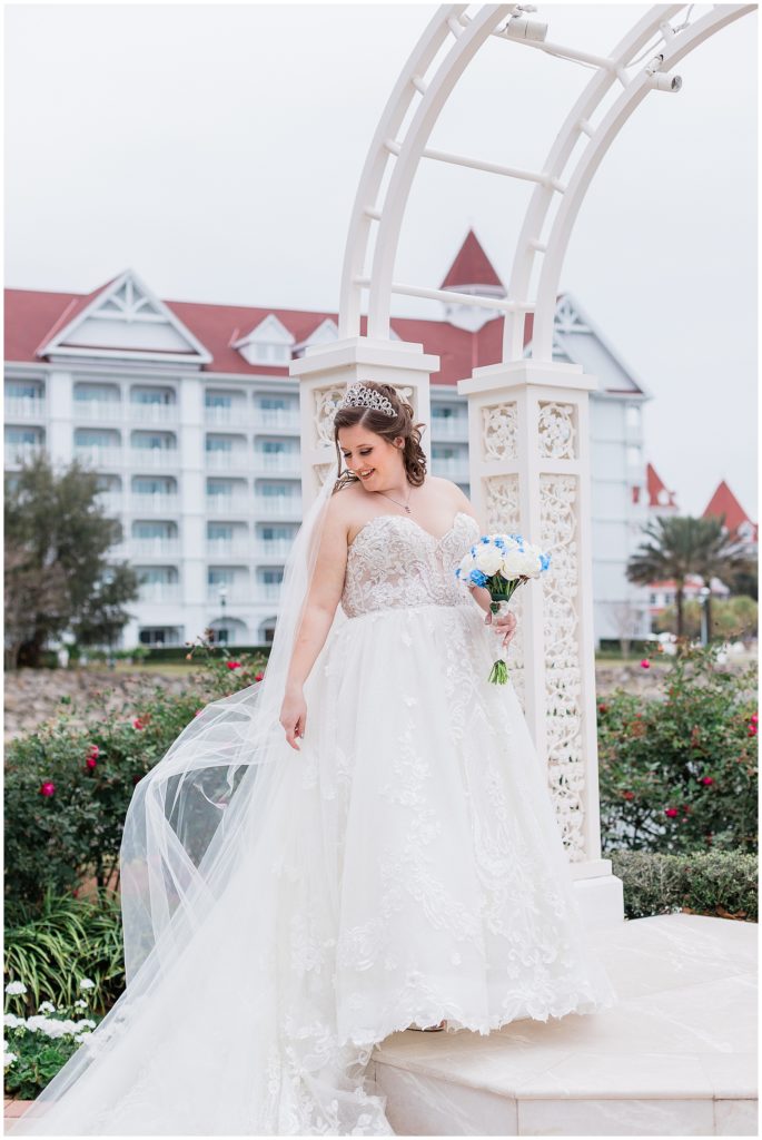 bride with Disney's Grand Floridian in the background