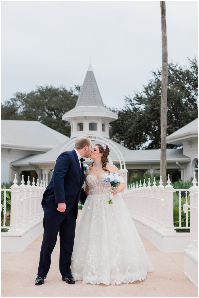 couple kissing on bridge at Disney's Wedding Pavilion