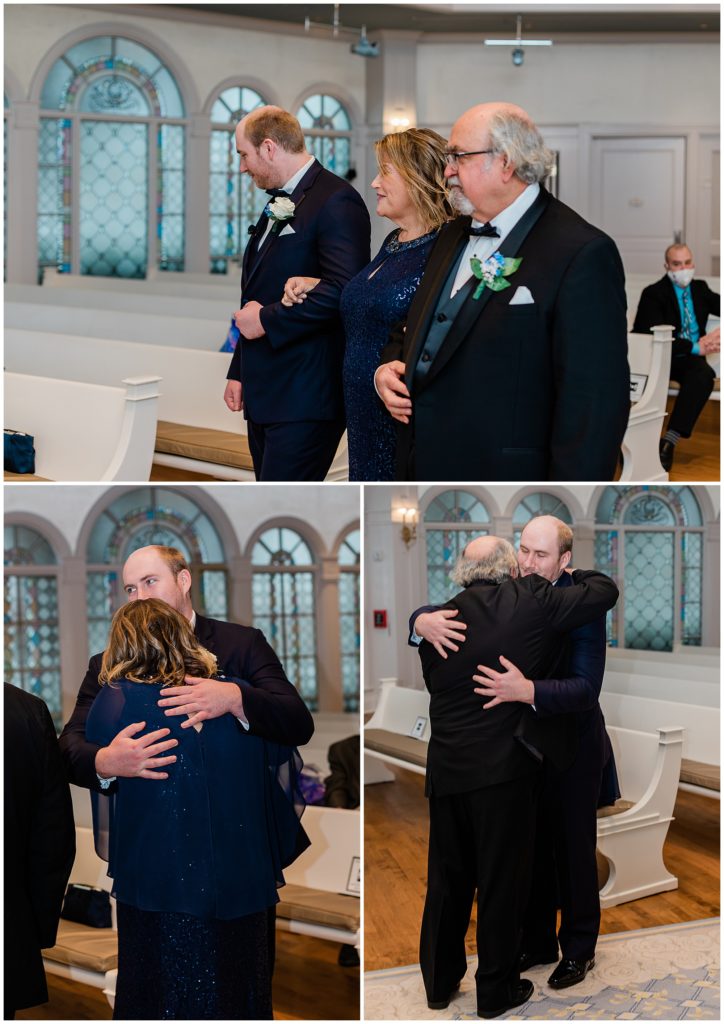 groom hugging parents to be seated at ceremony
