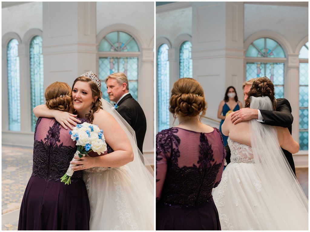 Bride hugging mom before she sits at ceremony