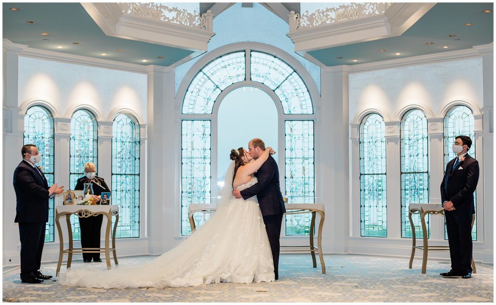 bride and groom share first kiss during the ceremony