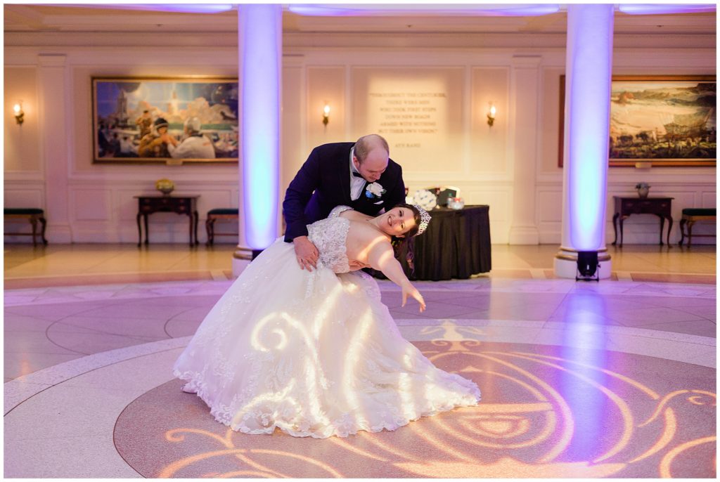 groom dipping bride to finish first dance