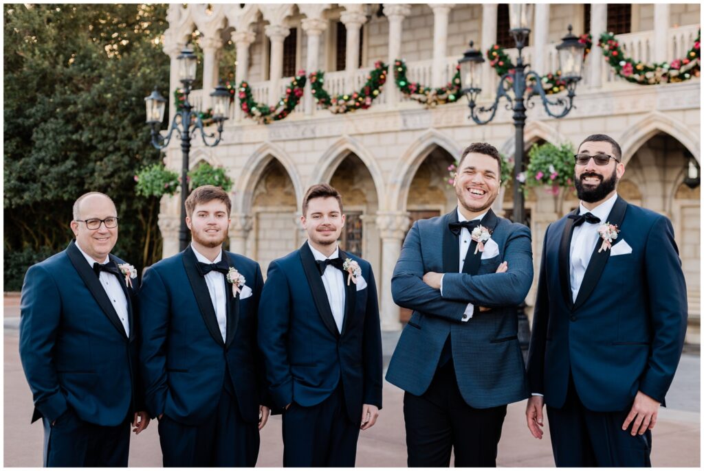 Groom and Groomsmen take portraits in Italy Pavilion during their Epcot Wedding at Walt Disney World