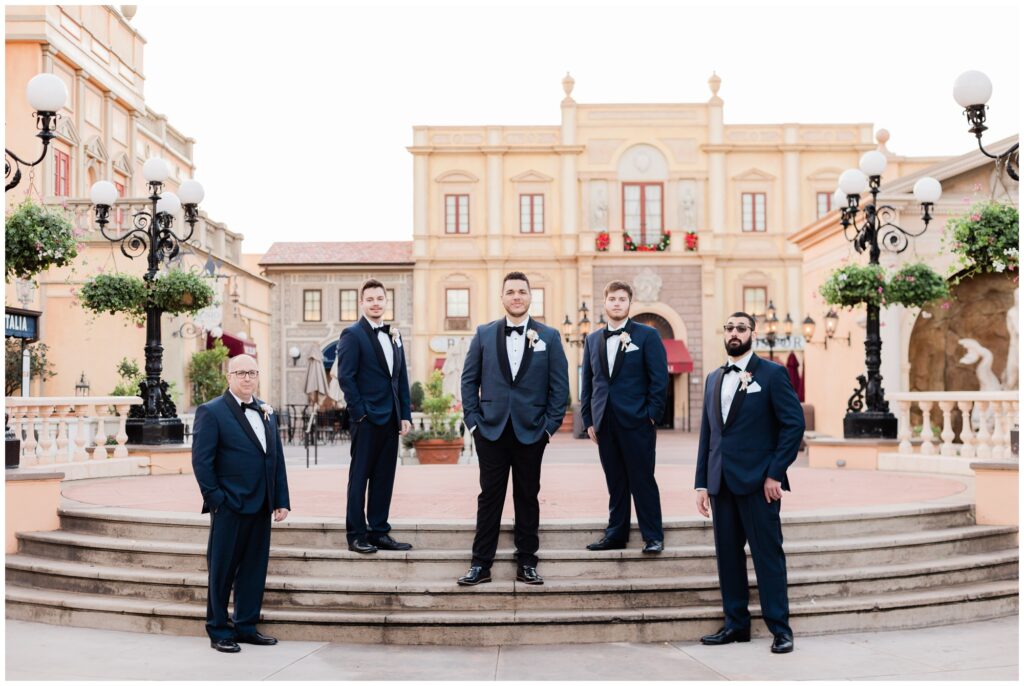 Groom and Groomsmen take portraits in Italy Pavilion during their Epcot Wedding at Walt Disney World