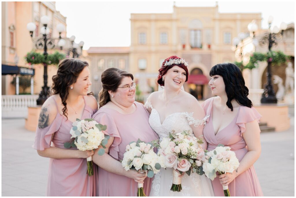 Bride and bridesmaids take portraits in Italy Pavilion during their Epcot Wedding at Walt Disney World