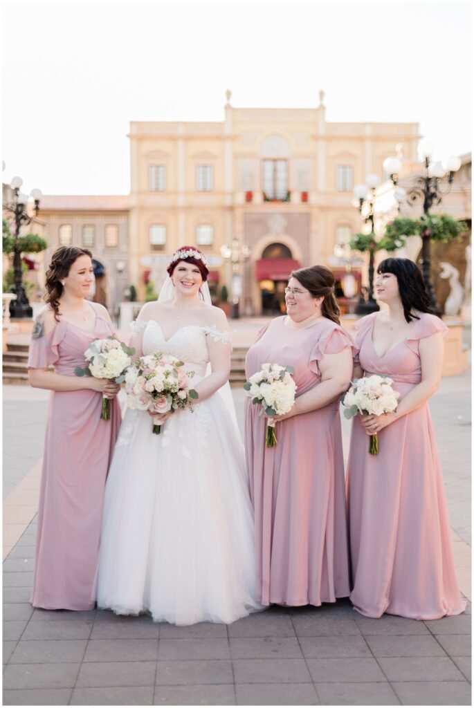 Bride and bridesmaids take portraits in Italy Pavilion during their Epcot Wedding at Walt Disney World